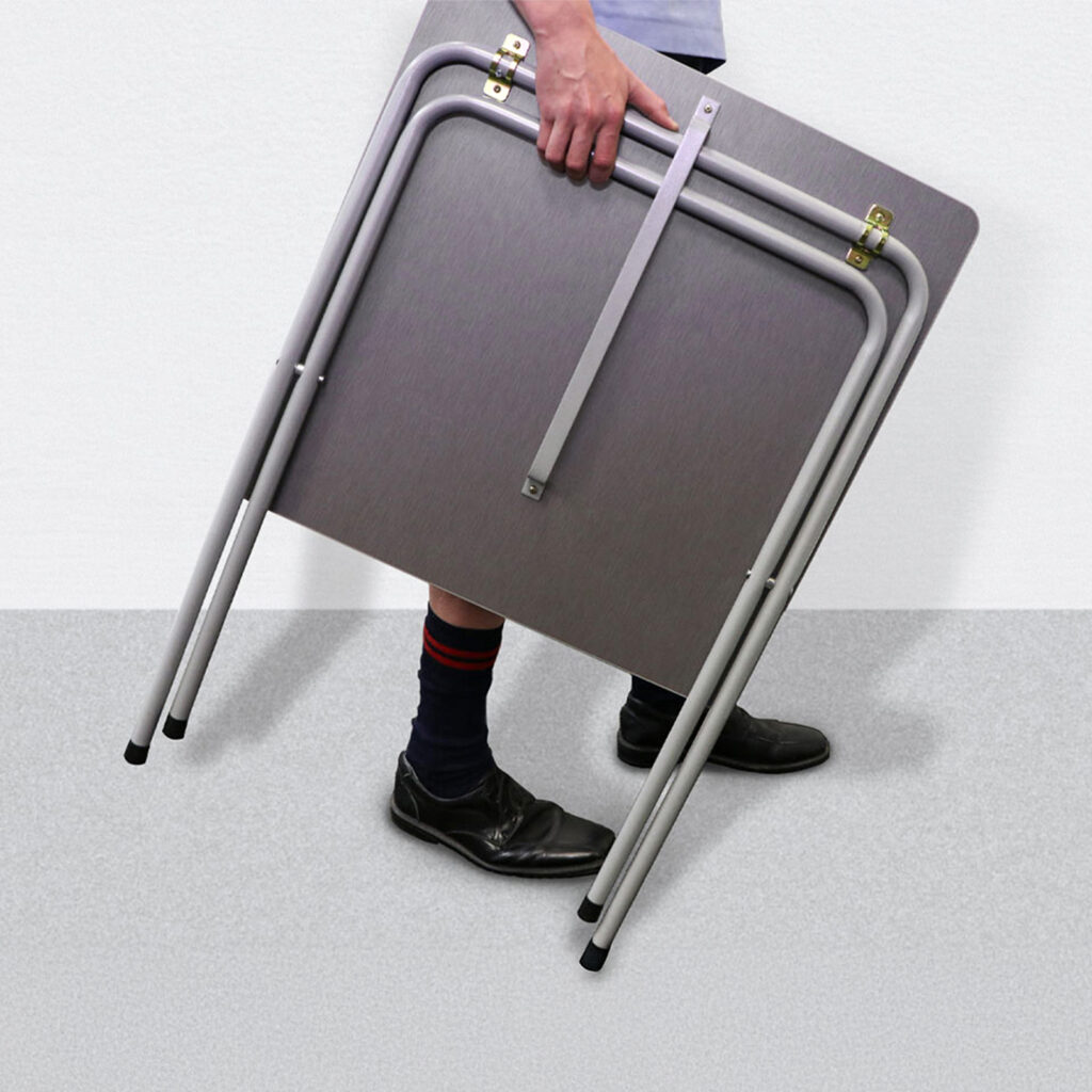 Folding Exam Desk Being Carried