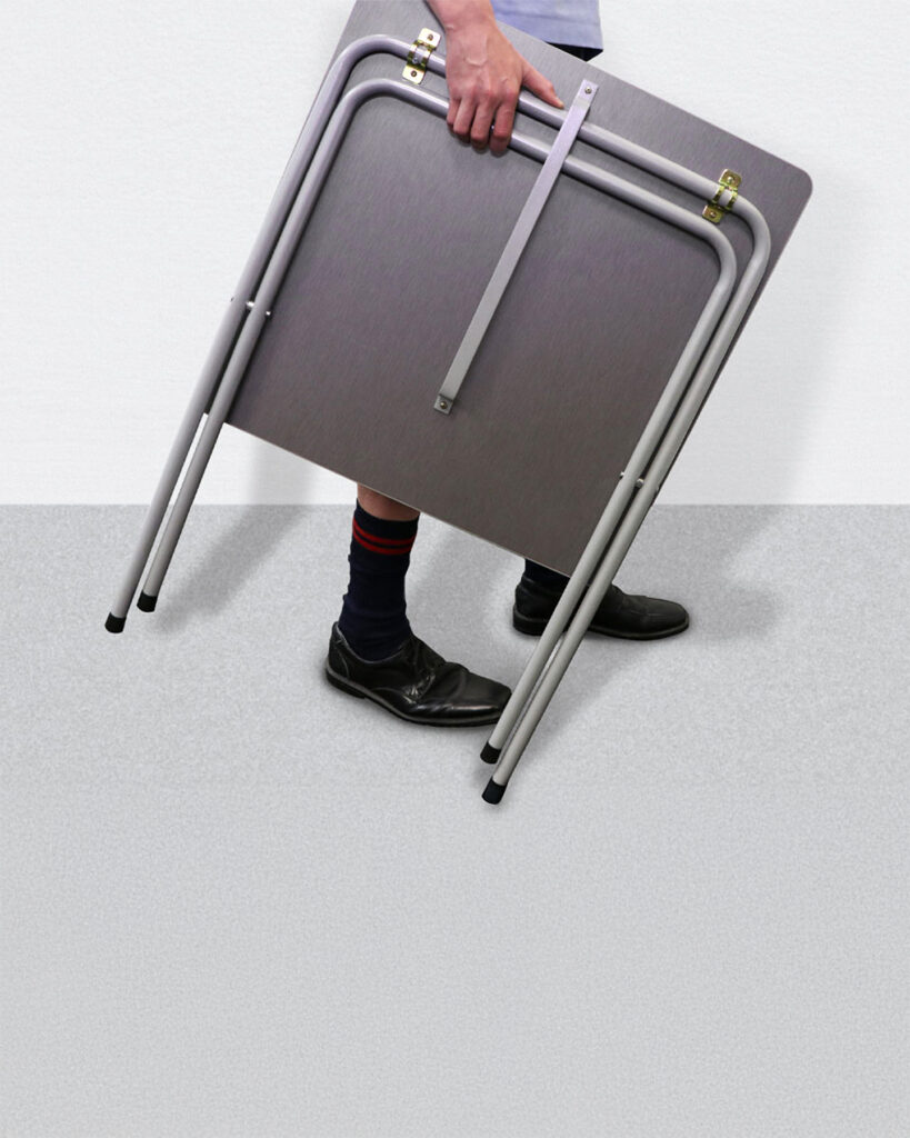folding-exam-desk-carried-by-student