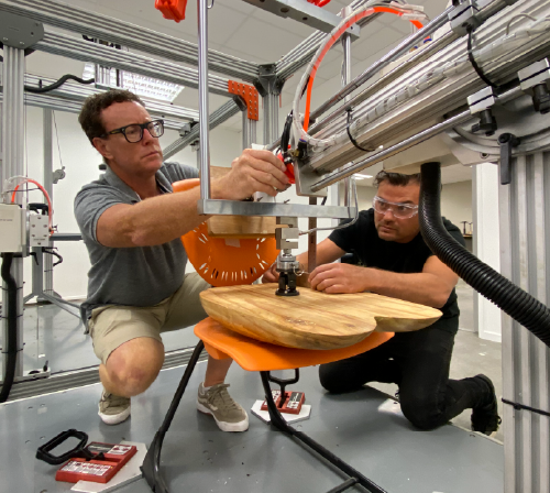 Two men working on product standardisation