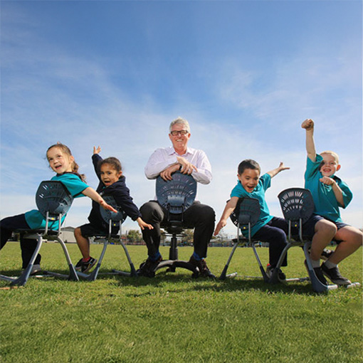 Hamish with kids on field