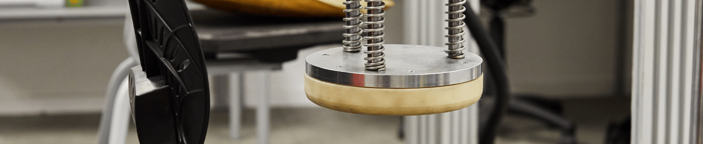 strength and durability testing of a bodyfurn chairt in the Furnware onsite test lab by the product designers