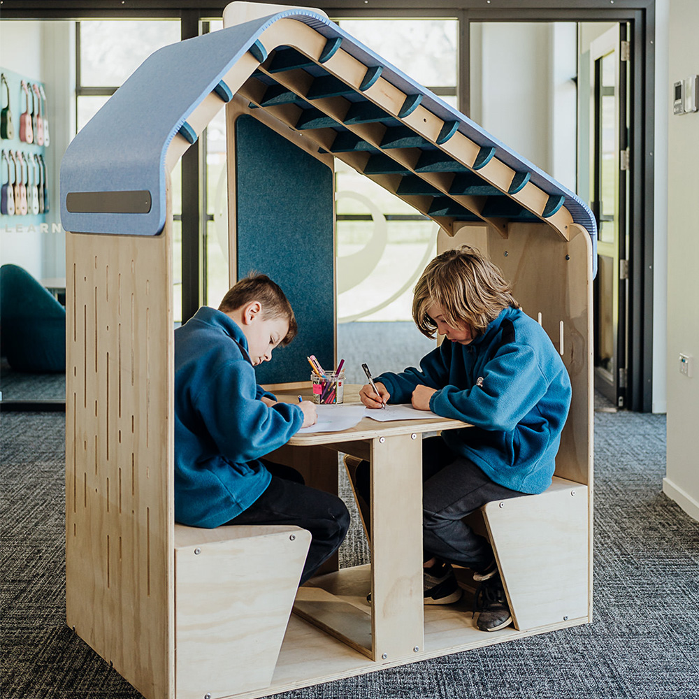 Students using a Mindfull learning hut for focused learning and collaboration in a school environment.