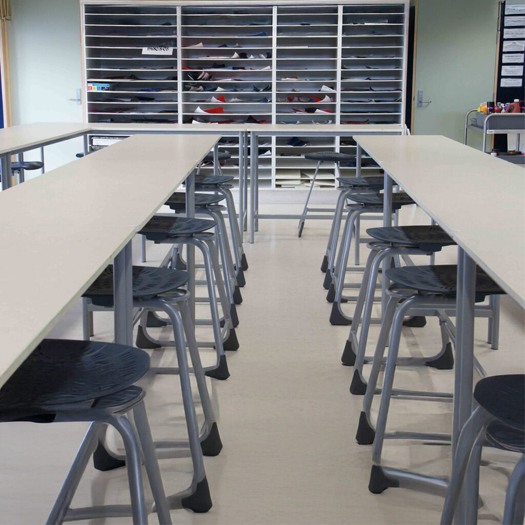 Secondary school STEAM classroom with high tables, stools and specialist learning storage