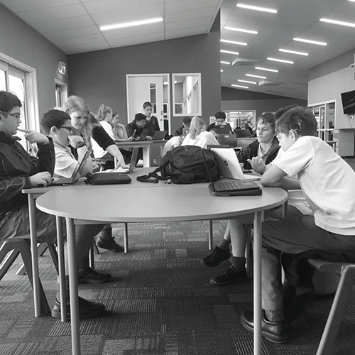 Classroom observation research showing students using different sitting positions while learning and working together.