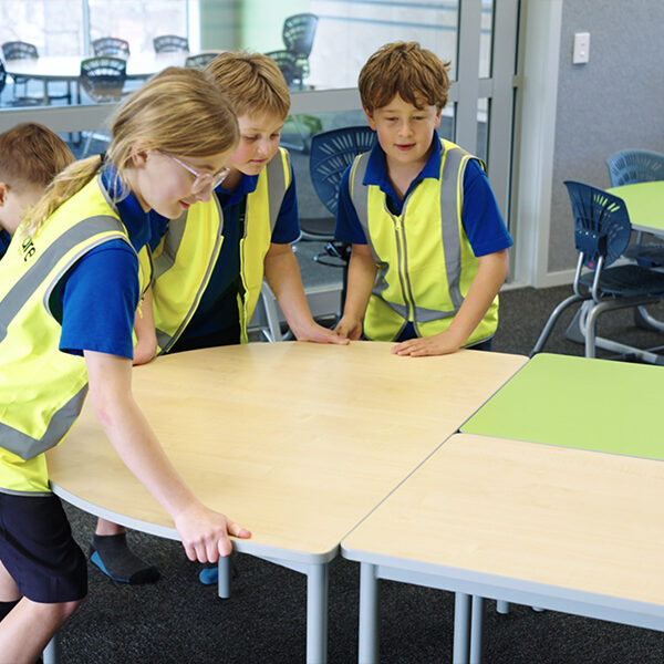 Elmwood Normal School students moving classroom furniture